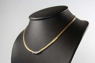 An 18ct yellow and white gold 5 stone brilliant cut diamond necklace 