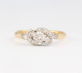 An 18ct yellow gold stone diamond crossover ring size S, 3.4 grams