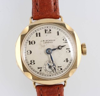 A lady's 9ct yellow gold J W Benson wristwatch with seconds at  6 o'clock on a leather strap 