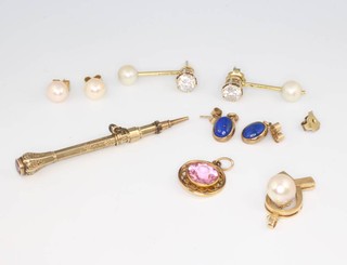 A 14ct yellow gold cultured pearl pendant, a propelling pencil, 3 pairs of earrings and a pendant