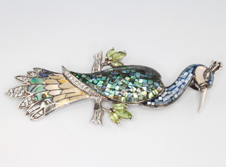 A Continental silver, mother of pearl and peridot bird brooch 10cm 