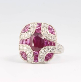 An Art Deco style ruby and diamond ring, the rubies approx. 3.48ct, diamonds approx 0.65ct, size M 1/2