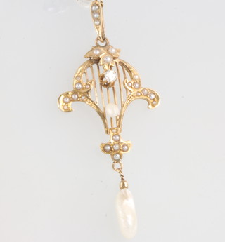 A 14ct yellow gold baroque seed pearl and diamond pendant and chain 52mm x 22mm