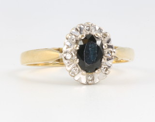 An 18ct yellow gold sapphire and diamond cluster ring, size P 1/2, 3.8 grams 
