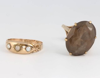 A 9ct yellow gold smoky quartz ring size L and an Edwardian yellow gold seed pearl ring size M 