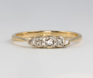 An 18ct yellow gold 5 stone diamond ring size R. 2.6 grams