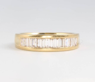 An 18ct yellow gold channel set baguette cut diamond ring, approx. 0.5ct, size J 