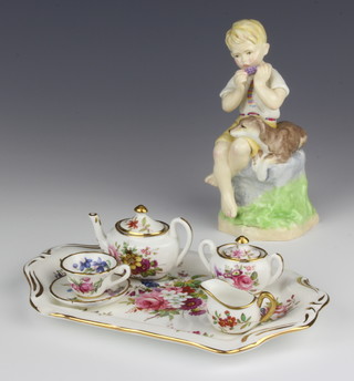 A Royal Worcester figure - June 3466 16cm and a Hammersley miniature tea set comprising tray, teapot, sugar bowl, cream jug, tea cup and tea saucer
