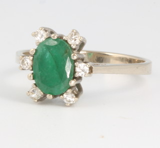 A 14ct white gold emerald and diamond ring size P 