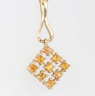 A 9ct yellow gold gold and sapphire pendant and chain 