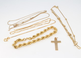 A 9ct yellow gold cross pendant and minor broken chains 11 grams 