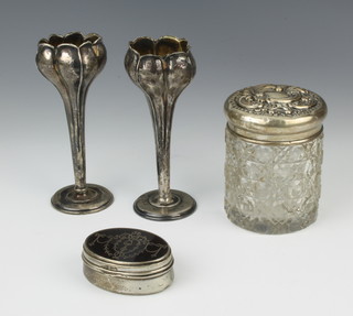 An Edwardian oval silver and tortoiseshell pique a jour trinket box with ribbon decoration, London 1905, 7cm x 5cm x 3cm together with a silver mounted toilet jar and 2 spill vases 
