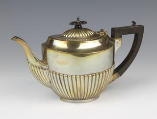 A silver demi-fluted breakfast teapot with ebony mounts maker John Rose