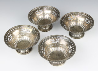 A set of 4 pierced silver bon bon dishes Sheffield 1910, maker Walker & Hall 214 grams 10.5cm 