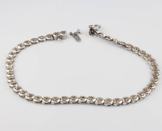 A 9ct white gold diamond set line bracelet 0.5ct, 19.5cm, 7.9grams 
