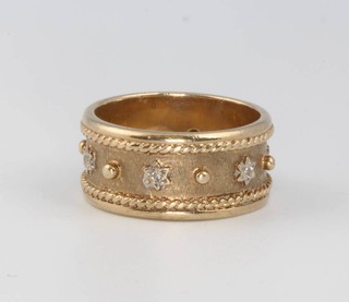 A 9ct yellow gold Etruscan style diamond set ring, size N, 6.8 grams