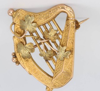 A 9ct 2 colour gold harp brooch, 2.3 grams