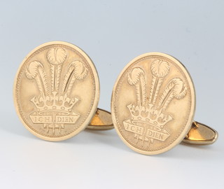 A pair of 9ct yellow gold cufflinks decorated the Prince of Wales feathers, 13.6 grams