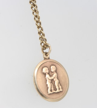 A 9ct yellow gold Gemini pendant and chain, 8 grams