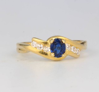 An 18ct yellow gold diamond and sapphire ring size I 1/2