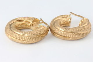 A pair of 9ct yellow gold textured hollow hoop earrings 2.6 grams
