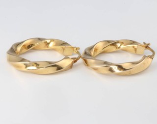 A pair of 9ct yellow gold hollow hoop earrings 2 grams