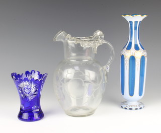 A Bohemian flash cut vase 26cm, a Czechoslovakian waisted blue vase and a clear glass jug 