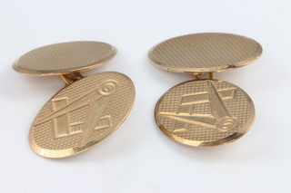A pair of 9ct yellow gold oval engine turned Masonic cufflinks 5.9 grams 
