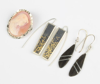 A pair of silver earrings by Jill Galloway-Whitehead, 1 other pair of earrings and a cameo 