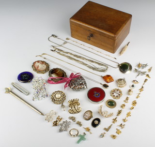 A walnut jewellery box containing an amber pendant and minor jewellery