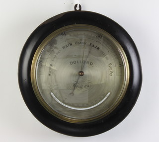 Dolland of London, a 19th/20th Century aneroid barometer with silvered dial contained in a turned ebonised case 28cm h