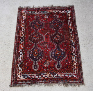 A red and blue ground Persian Qashqai rug with 2 rows of diamond medallions to the centre within a multi row border  199cm x 144cm 



