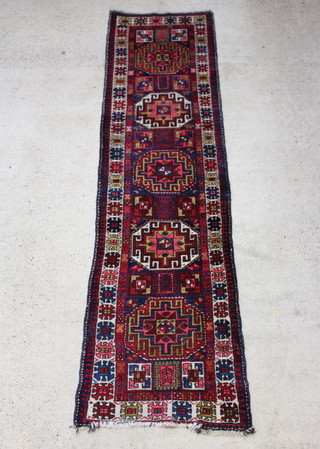 A blue and red ground Caucasian runner 330cm x 85cm 