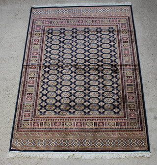 A blue ground Bokhara style Belgian cotton carpet with numerous octagons to the centre within a multi row border 230cm x 160cm 
