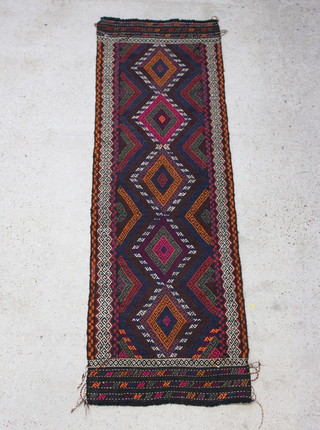 A Suzni Kilim runner with 5 stylised diamonds to the centre 233cm x 74cm 