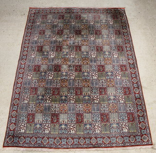 A tan, blue and red ground Persian carpet formed of 238 square panels with floral decoration 295cm x 214cm 