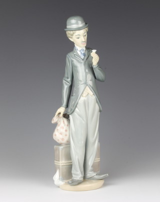 A Lladro figure - Charlie Chaplin with cane, boxed 28cm 