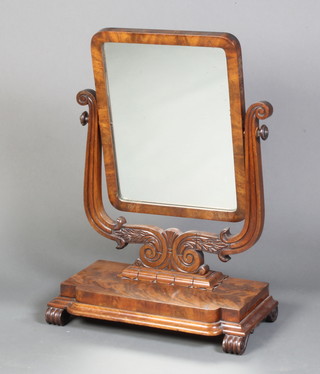 A William IV rectangular plate dressing table mirror contained in an inlaid mahogany swing frame, raised on a stepped base 73cm x 54cm x 27cm 