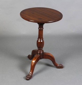 A 19th Century style circular mahogany wine table raised on pillar and tripod supports with egg and claw feet 68cm x 44cm diam. 