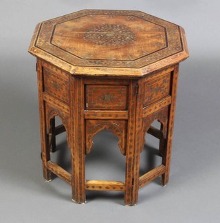A 19th Century Anglo Indian octagonal hardwood and brass inlaid occasional table raised on a folding stand 46cm x 46cm x 46cm 