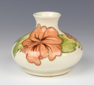 A modern Moorcroft squat vase the beige ground decorated with hibiscus 10cm 