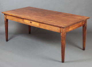 A 19th Century French cherry wood dining table, the top of plank construction, fitted a frieze drawer and raised on square tapered supports 73cm h x 160cm l x 88cm w 