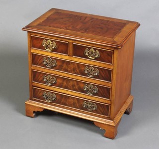 A miniature Queen Anne style chest with feather and crossbanded top fitted 2 short and 3 long drawers, raised on bracket feet 51cm h x 51cm w x 31cm d 