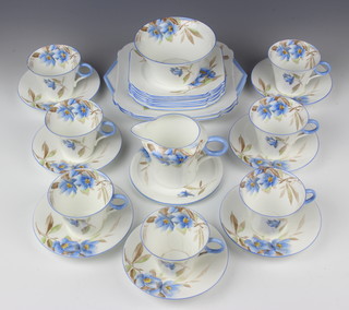 A Shelley Regent tea set decorated with flowers 12025 comprising 7 tea cups, milk jug, sugar bowl, teapot stand, 7 saucers, 7 side plates, 2 sandwich plates