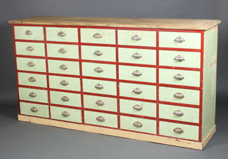 An impressive pine red and turquoise painted bank of 32 drawers with chrome handles 102cm h x 195cm w x 48cm d 