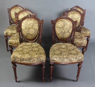 A set of 6 Victorian carved walnut show frame dining chairs with upholstered seats and backs 