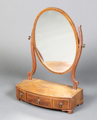 A 19th Century oval plate dressing table mirror in a mahogany swing frame, the crossbanded and inlaid bow front base fitted 1 long and 2 short drawers, raised on ogee bracket feet 59cm h x 41cm w x 20cm d  