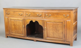 A 17th/18th Century style oak dog kennel dresser, fitted 3 long drawers above a dog kennel flanked by a pair of cupboards with brass swan neck drop handles 80cm h x 187cm w x 48cm d