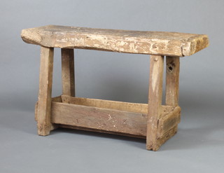 A 19th Century rustic rectangular weathered oak workbench raised on square supports with undertier 71cm h x 120cm w x 37cm d  