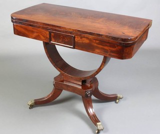 A William IV D shaped card table raised on U support with a platform base and out swept feet with brass caps and casters 72cm h x 89cm w x 44cm d 